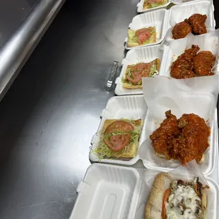 a long line of takeout food items