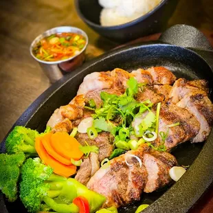 a plate of meat and vegetables