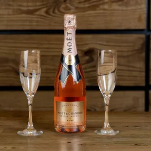 a bottle of champagne and two glasses