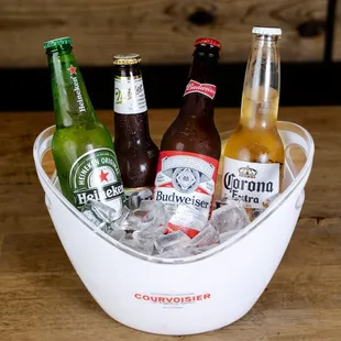 a bucket of beer bottles