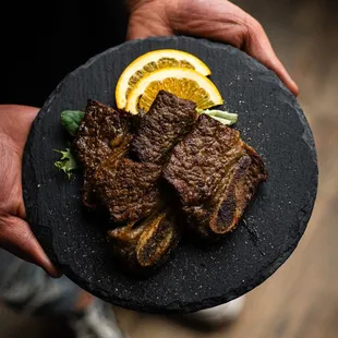 a person holding a plate of food