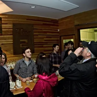 a group of people at a bar