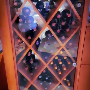 a display of wine bottles in a wine rack