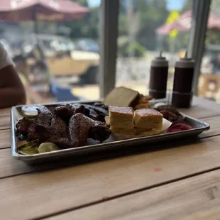 Wings, fried plantain, corn breed, chorizos, ribs, Mac and cheese.
