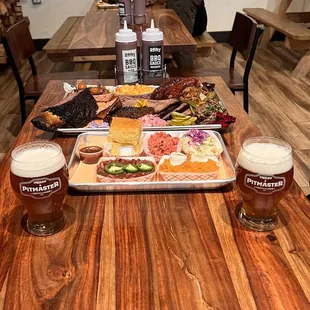 a man sitting at a table with a tray of food