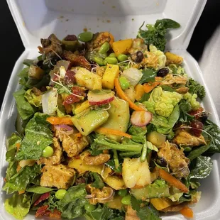 a salad in a styrofoam container