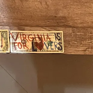 a close up of a sign on a shelf