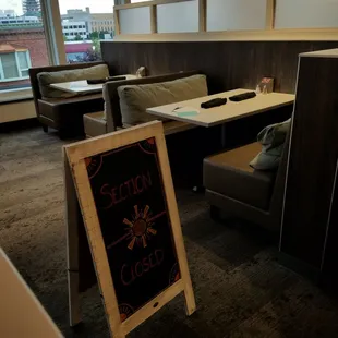 seating and a chalkboard sign
