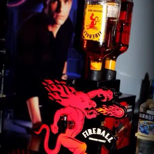 a man behind a beer machine