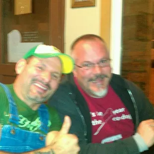 two men sitting at a table