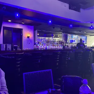 a woman sitting at a bar