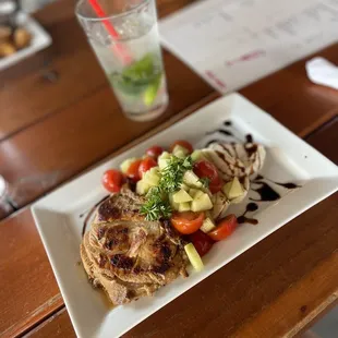 Cucumber and tomato salad with a side of chicken