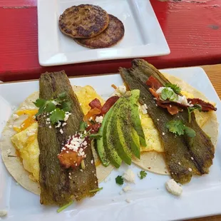 Breakfast tacos with sausage as the side