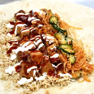 ows a tortilla with meat and vegetables