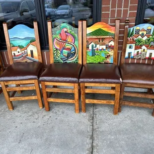 Chairs lined up outside. Inside is similarly themed