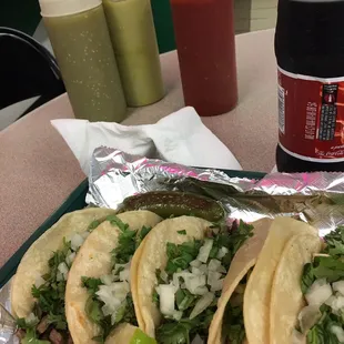 3 tacos carne asada -3 tacos de pollo. cilantro, fresh diced onions, grilled onions, and even a grilled jalapeño!