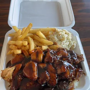 Teriyaki dinner plate with fries, Mac salad, chicken, rice and teriyaki sauce