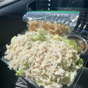 Chinese chicken salad (how it comes. Wontons and sesame seeds are in a separate bag, and the teriyaki sauce comes in a little to-go cup)