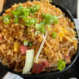 a bowl of fried rice with vegetables