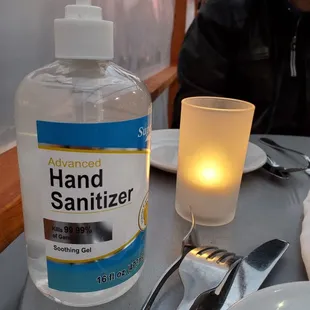 a bottle of hand sanitizer on a table