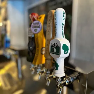 a row of beer taps