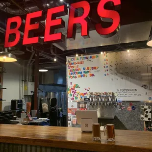 a bar with a sign that says beers