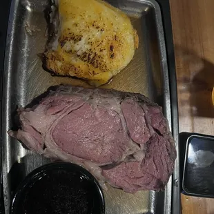 Small prime rib with twice baked potato