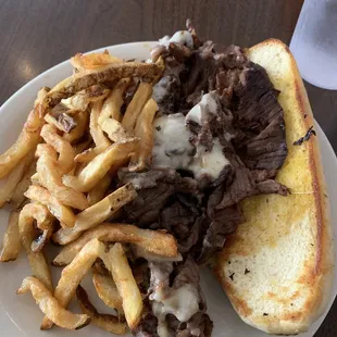 Philly cheese steak (without peppers and onions) and fries