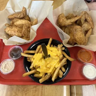 Whole wings, chicken tenders, cheesy fries and multiple dipping sauces!
