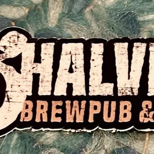 the logo for 3 halves brewing and bbq