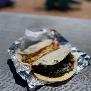 two tacos sitting on a table