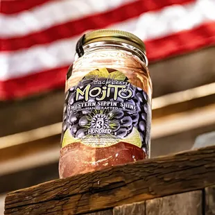 a jar of jam on a fence