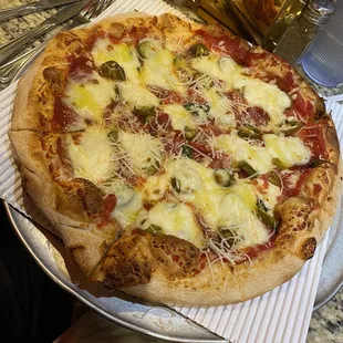 Margarita pizza with jalapeños, pepperoni and fontina added. This is one delicious pie!