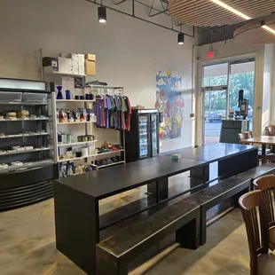 entrance, 12ft long table, grab and go coolers, merch, retail items