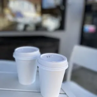 two cups of coffee on a table