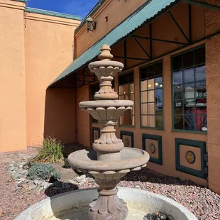 a fountain in front of a building