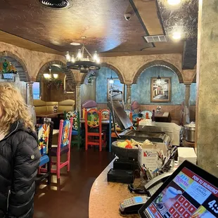 a woman standing in a restaurant