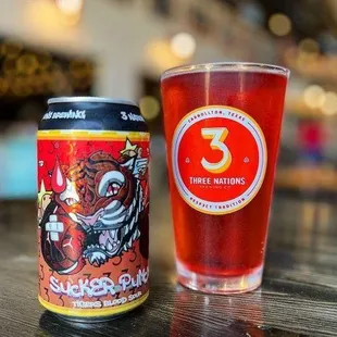 a can and a glass of beer