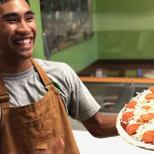 Our pizza guys will make your best personalized pizza.