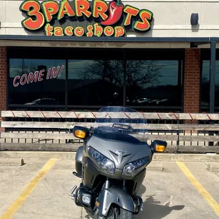 Outside of building, right on Hwy 377