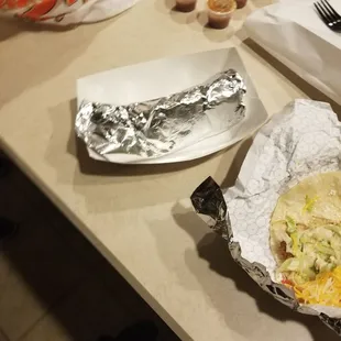 a burrito and a plate of cupcakes