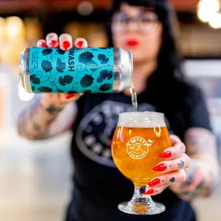 a bartender pours a beer