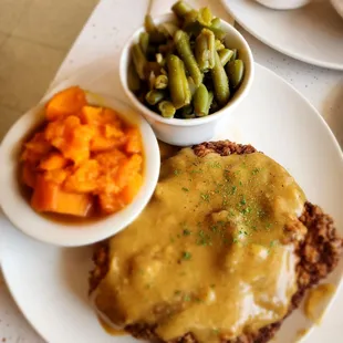 Chicken fried steak with sweet potatoes and green beans