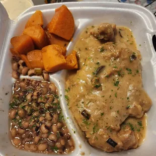 Smothered pork Chops, black eyed peas, and sweet potatoes