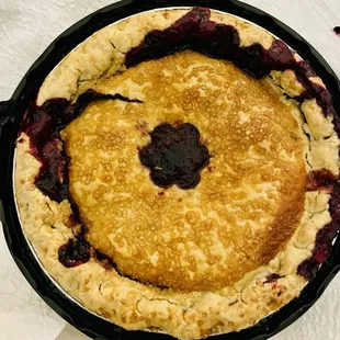 a blueberry pie in a cast iron skillet