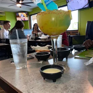 a margarita with a lime garnish on top