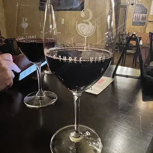 two glasses of wine on a table