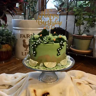 Margarita cake: lime cake with tequila buttercream frosting decorated with cacti / plants and tequila pipettes