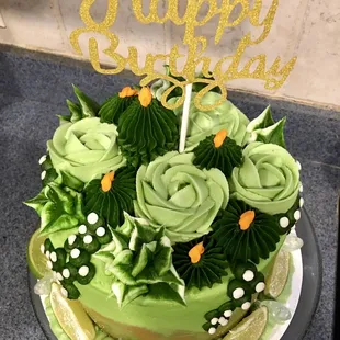 Margarita cake: lime cake with tequila buttercream frosting decorated with cacti / plants and tequila pipettes