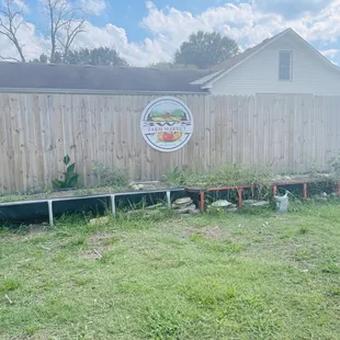 The side yard with shop logo